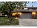 Charming front exterior of a home with attached two car garage at 15220 E Caley Ave, Centennial, CO 80016
