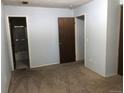 Bedroom features neutral walls, carpeted floor, and two entry points to other rooms at 16359 W 10Th Ave # 1, Golden, CO 80401