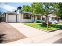 Inviting single story home with a well-maintained front yard, quaint mailbox and a one-car attached garage at 2294 W Parkhill Ave, Littleton, CO 80120