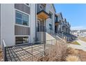Charming exterior view showcasing modern two-story architecture with covered entrances and meticulous landscaping at 242 Clementina St, Louisville, CO 80027