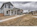 A nicely landscaped yard and sidewalk that leads to this charming two-story home at 710 Belay St, Erie, CO 80516