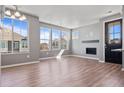 Spacious living room with fireplace and large windows at 23744 E Ida Pl # E, Aurora, CO 80016