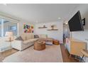 Inviting living room with hardwood floors, a comfortable sectional, and ample natural light at 3753 N Cook St, Denver, CO 80205