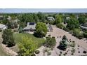 Aerial view of a property featuring a large, beautifully landscaped yard at 6633 E 166Th Pl, Brighton, CO 80602