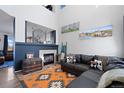 Inviting living room with a fireplace, stylish decor, and comfortable seating, perfect for relaxation at 11671 Elkhart, Brighton, CO 80603
