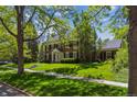 Traditional brick home with well-maintained lawn and mature landscaping at 2222 E 7Th Avenue Pkwy, Denver, CO 80206