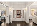 Elegant foyer with hardwood floors, stylish sconces, and a vintage radiator at 637 N Franklin St, Denver, CO 80218