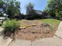 A home with a lot that needs landscaping work but has a covered front porch at 3984 S Pitkin Way, Aurora, CO 80013