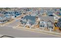 Lovely aerial shot of neighborhood showing many two-story homes and well-maintained lawns under beautiful blue skies at 21821 E 7Th Ave, Aurora, CO 80018
