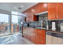 Bright kitchen featuring stainless steel appliances, dark backsplash, and access to balcony at 1700 Bassett St # 412, Denver, CO 80202