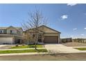Charming single-story home with a two-car garage, green lawn and inviting curb appeal at 17720 Weymouth Ave, Parker, CO 80134