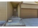 Inviting front entrance with a welcoming door and convenient attached two-car garage at 17720 Weymouth Ave, Parker, CO 80134