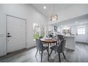 Bright dining area features modern lighting and seamless flow to the kitchen at 16086 E Ithaca Pl # D, Aurora, CO 80013