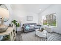 Inviting living room with neutral decor, bright natural light, and modern furnishings at 16086 E Ithaca Pl # D, Aurora, CO 80013
