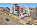 Modern building exterior with colorful accents, balconies, and convenient parking at 2374 S University Blvd # 503, Denver, CO 80210