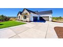 Spacious three car garage and wide concrete driveway on this lovely home at 7572 Kelty Trl, Franktown, CO 80116
