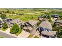 Spacious home with stunning aerial views of lush green spaces, offering a serene and private setting at 6787 Serena Ave, Castle Pines, CO 80108