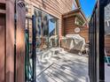 Outdoor patio with a grill, dining set, and sliding glass door, perfect for relaxation at 9365 W 80Th Pl # C, Arvada, CO 80005