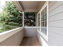 View from the covered balcony showing the mature evergreen tree at 19240 E Carolina Dr # 104, Aurora, CO 80017