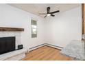 Bright living room features a fireplace and a large window, with lots of natural light at 3035 Oneal Pkwy # 20V, Boulder, CO 80301