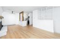 Open living space with hardwood floors, fireplace, and a view of the kitchen at 3035 Oneal Pkwy # 20V, Boulder, CO 80301