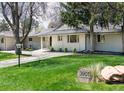 Attractive single story exterior with green lawn and sidewalk leading to the front door at 3901 S Dexter St, Cherry Hills Village, CO 80113