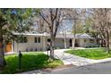 Charming single-story home with manicured lawn and mature trees at 3901 S Dexter St, Cherry Hills Village, CO 80113