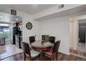 Cozy dining room features seating for four and is connected to the kitchen at 3550 S Harlan St # 249, Denver, CO 80235