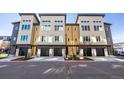 Contemporary townhome complex boasts modern architecture and convenient garage access at 5227 N Eliot St, Denver, CO 80221