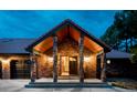 Inviting entryway with brick pillars and a wood ceiling at 12570 W 60Th Ave, Arvada, CO 80004