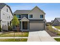 Charming two-story home with a well-maintained lawn and attached two-car garage at 5352 Truckee St, Denver, CO 80249