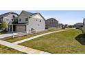 Landscaped side yard features a white picket fence and leads to the home at 5352 Truckee St, Denver, CO 80249