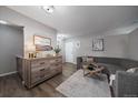 Inviting living room with wood-look flooring, gray couch, and stylish decor at 855 N Pennsylvania # 207, Denver, CO 80218