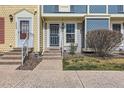 Close up of the entrance with charming design details and easy access at 9467 W Ontario Dr, Littleton, CO 80128