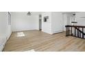 Bright living room with natural light and wood-look floors, perfect for entertaining at 2633 Mather St, Brighton, CO 80601