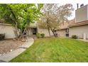 Beautiful home with well-maintained front yard and a stone walkway leading to the inviting front entrance at 2459 S Xanadu Way # B, Aurora, CO 80014