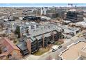 An aerial view of a modern multi-Gathering unit showcases its rooftop design and surrounding downtown neighborhood at 350 Detroit St # 107, Denver, CO 80206