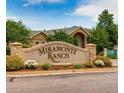 Miramonte Ranch community entrance sign with manicured landscaping and stone accents on a sunny day at 1016 Opal St # 102, Broomfield, CO 80020