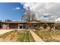 Charming brick ranch-style home with attached garage, well-maintained lawn, and mature trees at 2785 Skyline Dr, Westminster, CO 80030