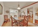 Charming dining room with wood trim, a pendant light, and a bay window at 2038 S Hoyt Way, Lakewood, CO 80227