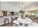 Cozy dining area adjacent to the kitchen, perfect for casual meals and entertaining, with natural light at 3750 S Fairplay Way, Aurora, CO 80014