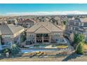 Expansive backyard with a deck, patio, hot tub, fire pit, and a well-manicured lawn for outdoor enjoyment at 27655 E Moraine Dr, Aurora, CO 80016
