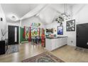 Spacious open-plan dining area with large windows, modern decor, and stylish accents, perfect for entertaining at 8370 W Evans Pl, Lakewood, CO 80227