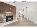 Open living room showcasing a fireplace and kitchen view at 165 S Sable Blvd # R14, Aurora, CO 80012