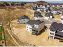 Aerial view of a newly constructed home on a spacious lot in a residential neighborhood at 5722 Farrier Pt, Castle Rock, CO 80104