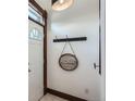 Welcoming foyer with a charming 'Home' sign and stylish decor near the front door at 320 E Dakota Ave, Denver, CO 80209