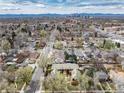 Expansive aerial view of the neighborhood, showcasing its tree-lined streets at 1419 Dexter St, Denver, CO 80220