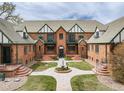 Unique complex offers appealing architecture, lovely courtyard with fountain, and relaxing curb appeal at 1419 Dexter St, Denver, CO 80220