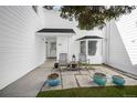 Inviting front porch features seating and decorative planters at 4505 S Yosemite St # 433, Denver, CO 80237