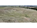 Expansive land for sale featuring rolling green hills and blue skies at 1740 Michael Gates Dr, Parker, CO 80138